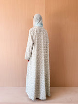 Zainah cut abaya with lace on front in off white with green leaf