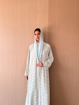 Zainah cut abaya with lace on front in off white with green leaf